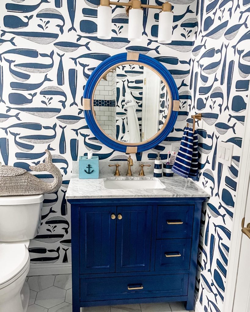 Kids Bathroom Renovation | Nautical Bathroom | Preppy Bathroom | Navy and White Bathroom | Navy Vanity | Serena and Lily Wallpaper | Pottery Barn Kids | Hexagon Tile | Shower Niche | Border Tile | Bathroom Remodel | Classic Bathroom | Brushed Gold Hardware