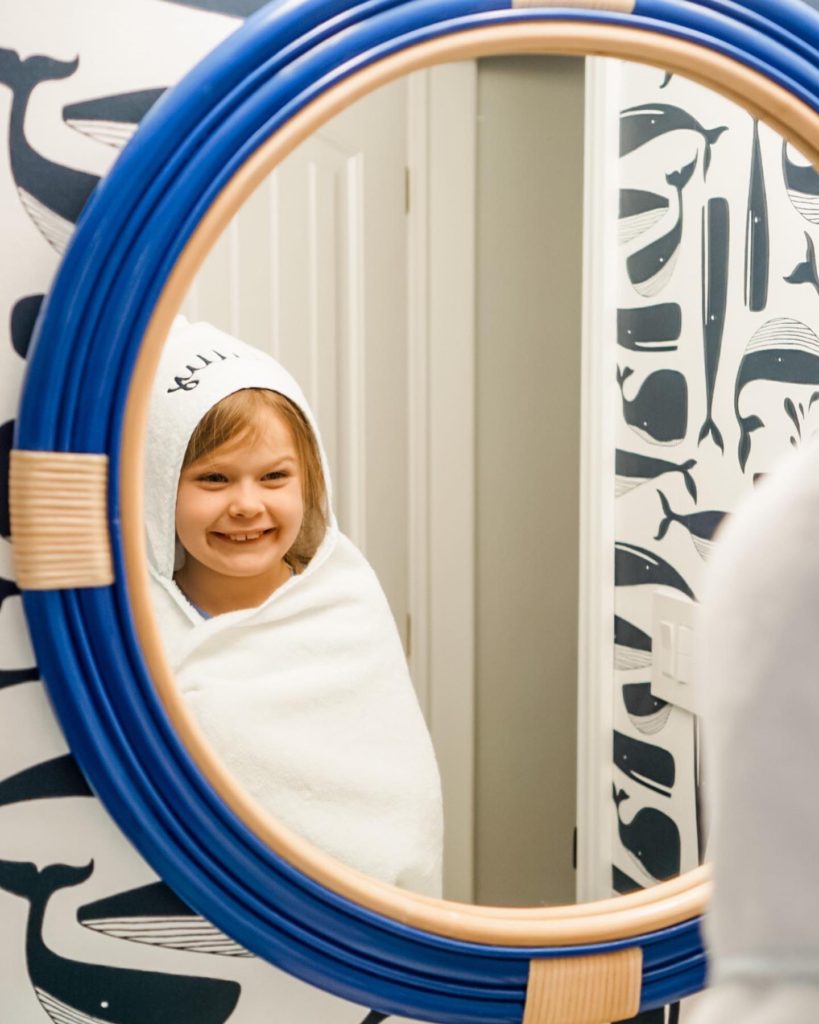 Kids Bathroom Renovation | Nautical Bathroom | Preppy Bathroom | Navy and White Bathroom | Navy Vanity | Serena and Lily Wallpaper | Pottery Barn Kids | Hexagon Tile | Shower Niche | Border Tile | Bathroom Remodel | Classic Bathroom | Brushed Gold Hardware